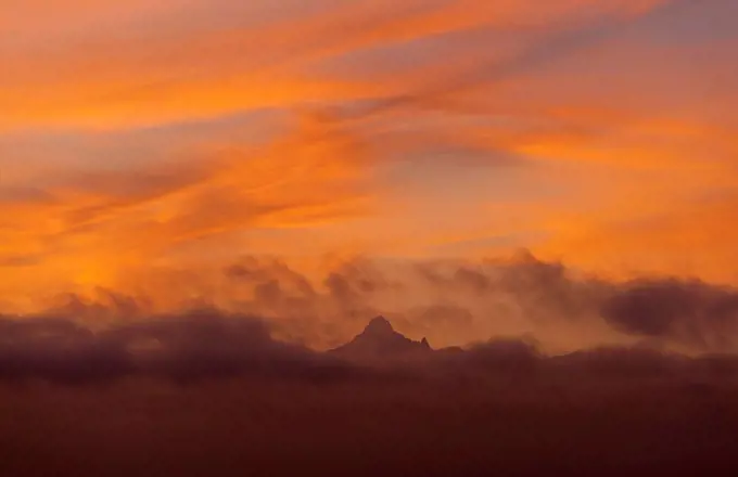 Mt Kenya coming out from clouds at dawn, Ol Pejeta Conservancy; Kenya