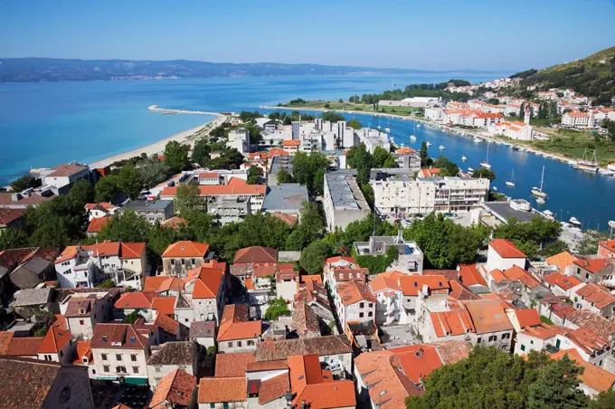 Red rooftops and view of the Dalmatian Coast; Omis, Split-Dalmatia, Croatia