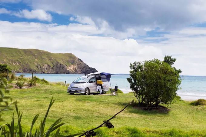 A beachfront campsite on the northernmost tip of the Coromandel Peninsula; Port Jackson, Waikato, New Zealand