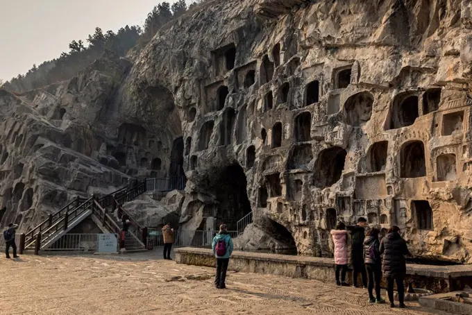 The Longmen Caves, some of the finest examples of Chinese Buddhist art housing tens of thousands of statues of Buddha and his disciples; Luoyang, Hena...