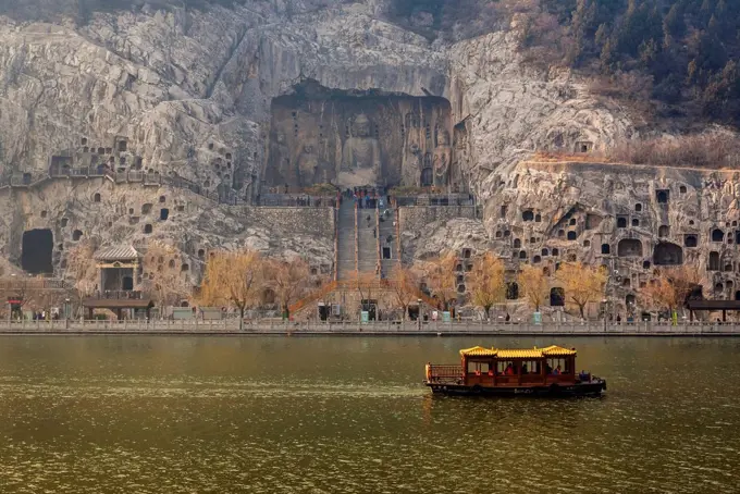 The Longmen Caves, some of the finest examples of Chinese Buddhist art housing tens of thousands of statues of Buddha and his disciples; Luoyang, Hena...