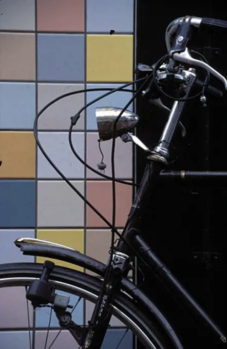 Bicycle and tiled wall in Amsterdam, Amsterdam, Netherlands