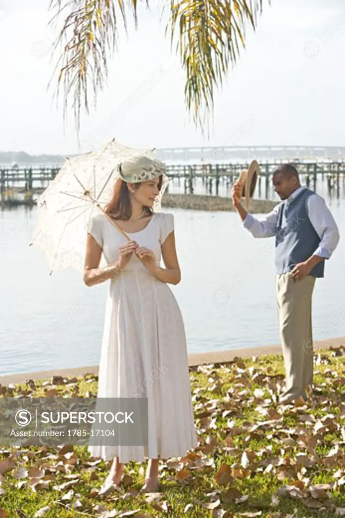 Portrait of 1920s socialites by water