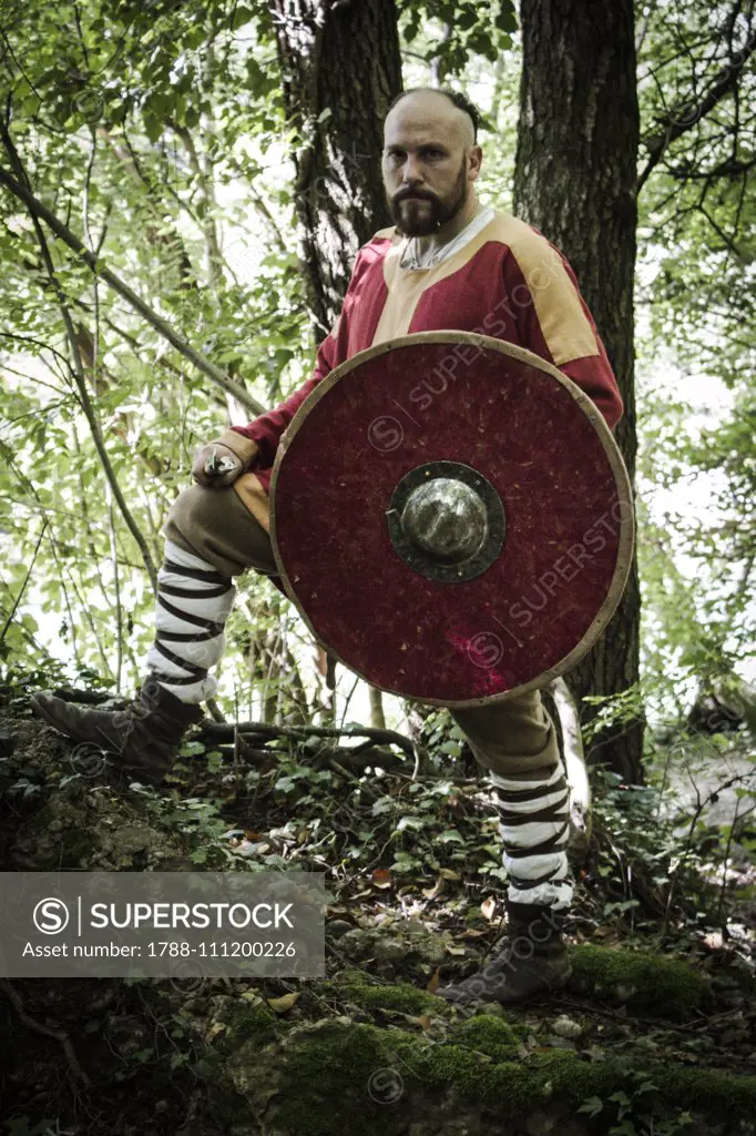 Langobard warrior carrying a shield and spear