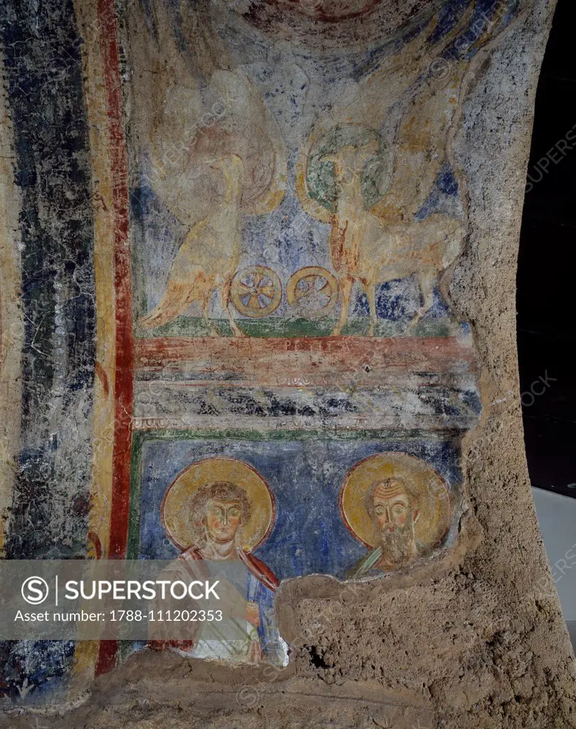 Remains of frescoes depicting the symbols of the Evangelists, next to the bell tower of the church of the Abbey of Saint Scholastica, Subiaco, Lazio, Italy, 6th-14th century.