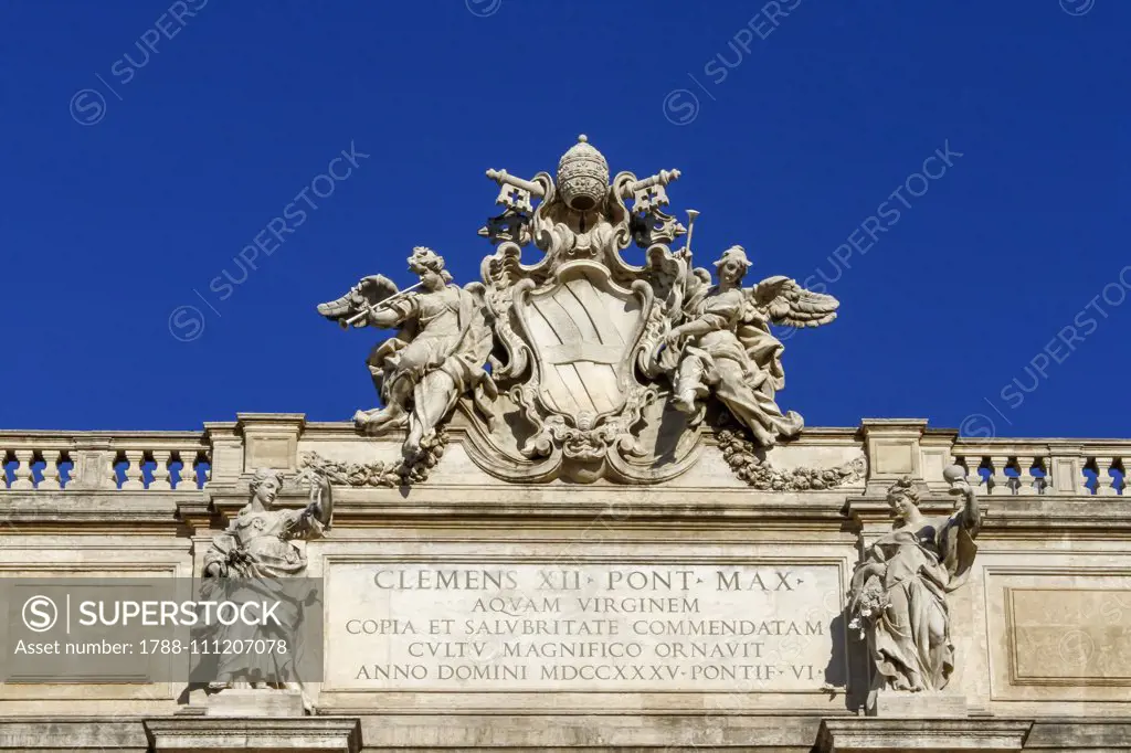 Corsini Family's coat of arms and memorial inscription of Pope Clement XII, Trevi Fountain, 1732-1762, by Nicola Salvi and Giuseppe Pannini, Rome (UNESCO World Heritage List, 1980), Lazio. Italy, 18th century. Detail.