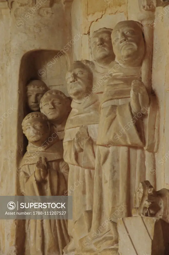 Monks praying, relief next to the Abbey chair, cloister of Cadouin Abbey (Notre-Dame de la Nativite), Le Buisson-de-Cadouin, New Aquitaine, France, 15th-16th century.