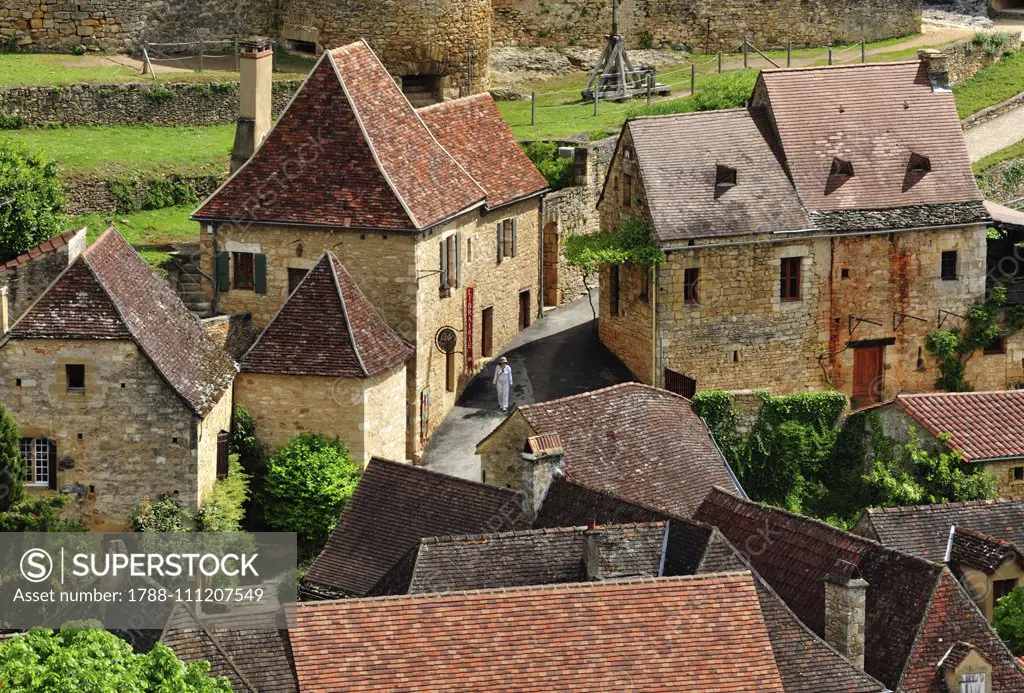 Houses at the foot of Castelnaud Castle, Castelnaud-la-Chapelle, New Aquitaine, France.