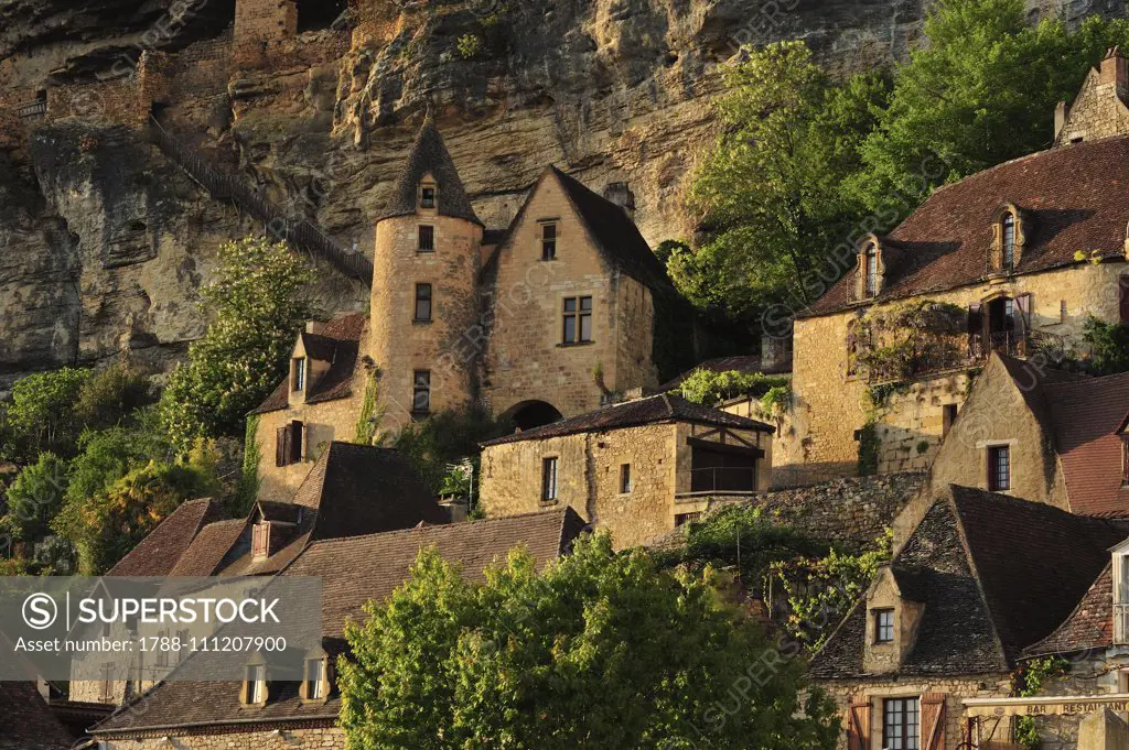 View of La Roque-Gageac and Tarde Castle, 15th century, New Aquitaine, France.