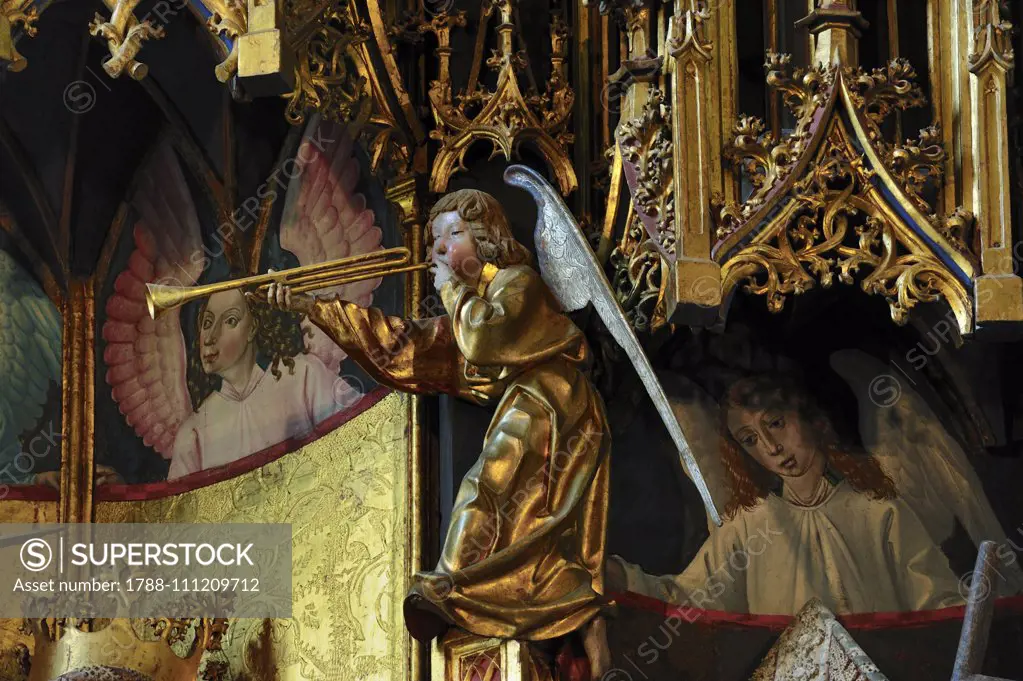 Statue of an angel playing the trumpet, detail of the Altarpiece with the Coronation of the Virgin, 1471-1475, carved wood, by Michael Pacher (died 1498), Old Parish Church of Gries, Bolzano, Trentino-Alto Adige, Italy, 15th century.