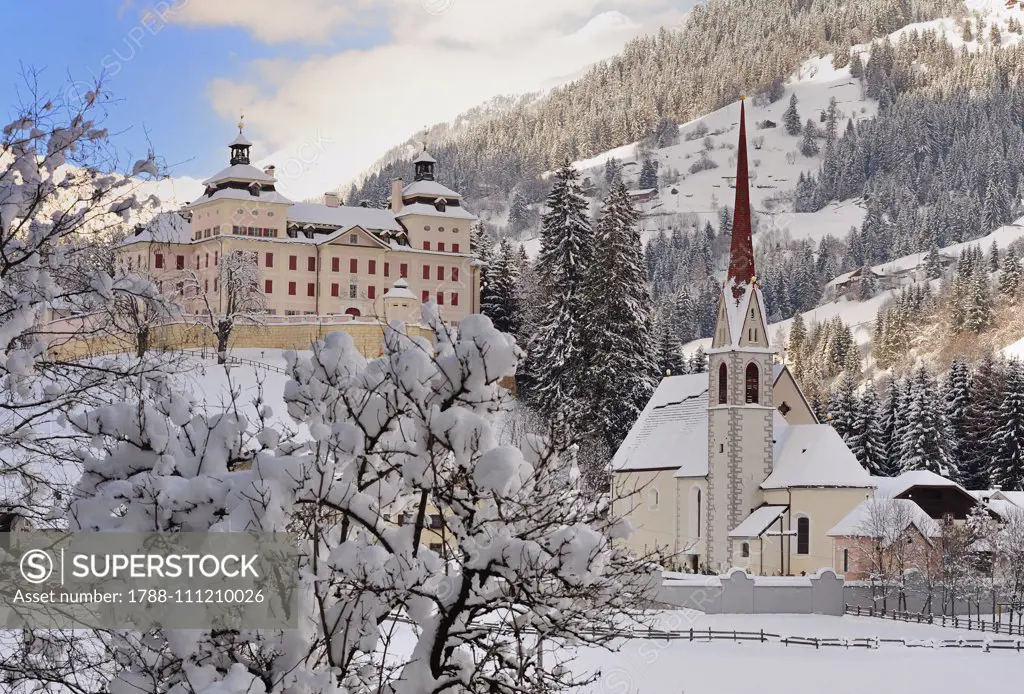 Winter view of Castel Mareta and the Church of San Pancrazio, Mareta, Racines, Trentino-Alto Adige, Italy.