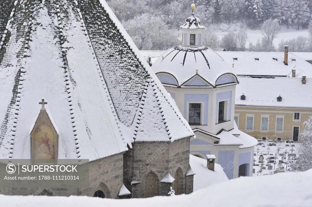 Apse of Saint Mary of the Assumption Church under snow, Novacella Abbey, Vahrn, Eisack Valley, Trentino-Alto Adige, Italy.