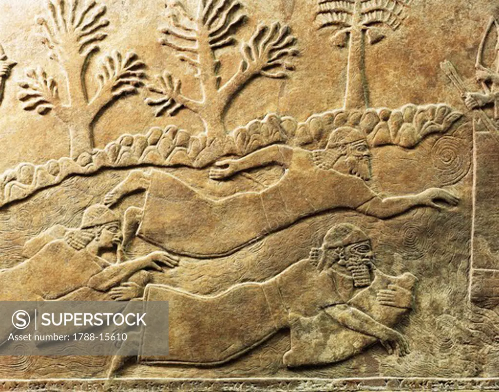 Relief with scene of flight from city besieged by Ashurbanipal, from ancient Nimrud, Calah, Iraq