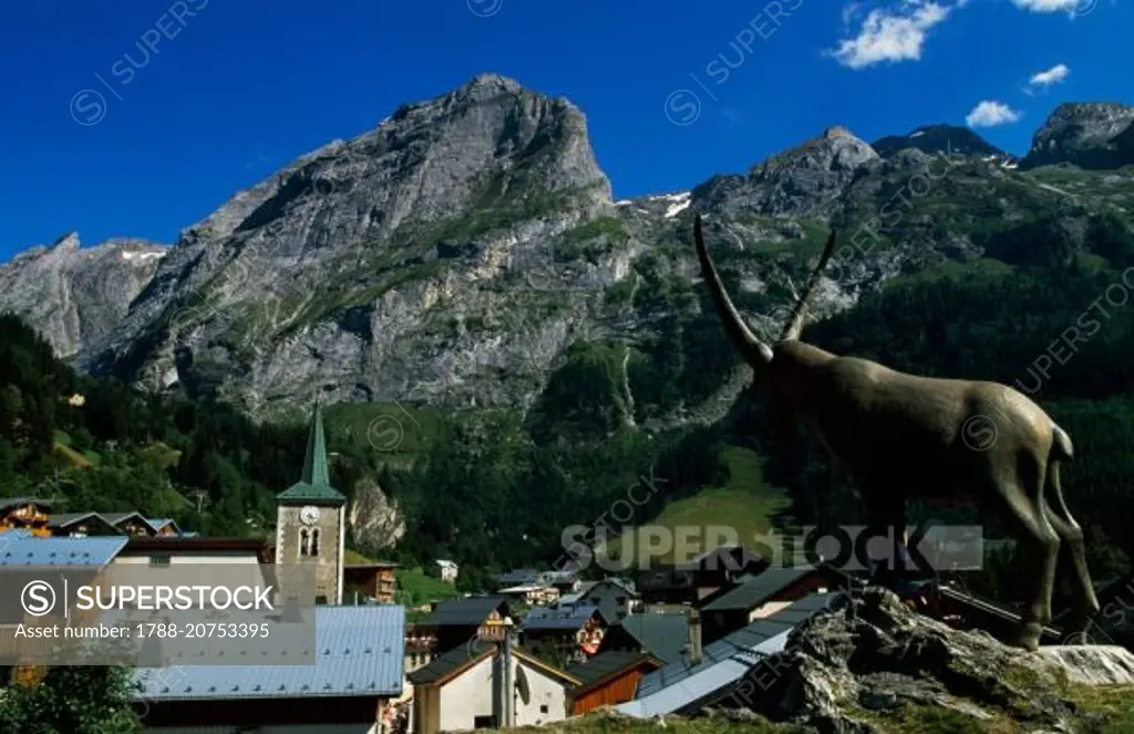 Ibex statue and view of Pralognan-La-Vanoise, Vanoise National Park (Parc national de la Vanoise), Savoie, France.