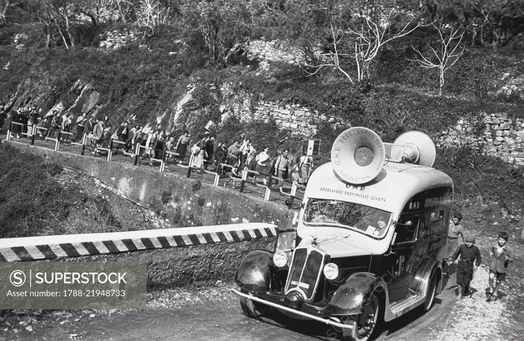 A car with loudspeakers during an excursion by the National Recreational Club (Opera nazionale dopolavoro, OND), April 5, 1936, province of Genoa, Italy, 20th century.