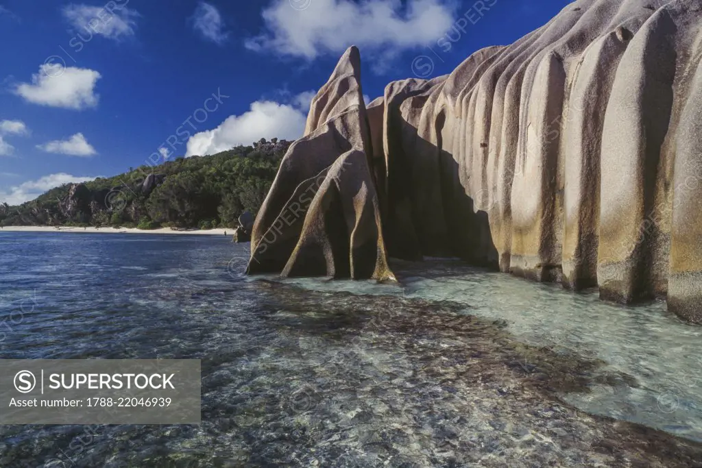 Granite rock face overlooking the sea, Anse Pierrot, La Digue Island, Seychelles.