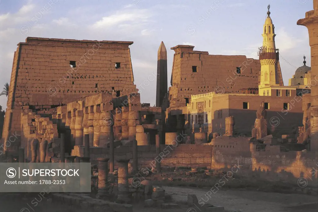 Egypt - Ancient Thebes (UNESCO World Heritage List, 1979). Luxor. Temple of Amon and Abu al-Haggag mosque. Sunset