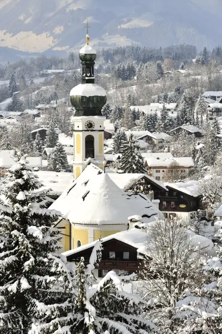 The church of Saint Pancras covered by snow, Reit Im Winkl, Upper Bavaria, Germany.