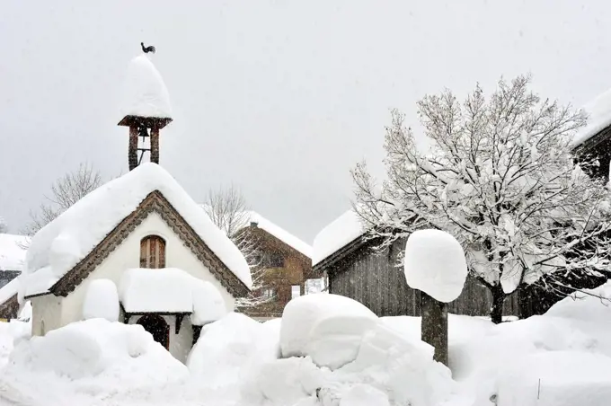 Small snow-covered church near Reit Im Winkl, Upper Bavaria, Germany.