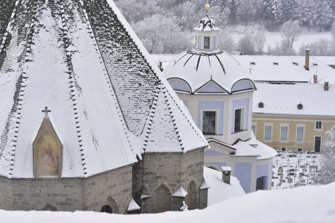 Apse of Saint Mary of the Assumption Church under snow, Novacella Abbey, Vahrn, Eisack Valley, Trentino-Alto Adige, Italy.