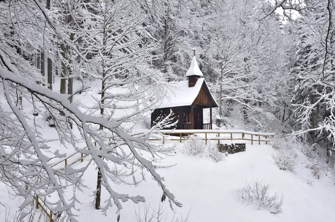 Wooden church in the snow, in the military cemetery for the soldiers fallen during World War I, Slaghenaufi, Lavarone, Trentino-Alto Adige, Italy.