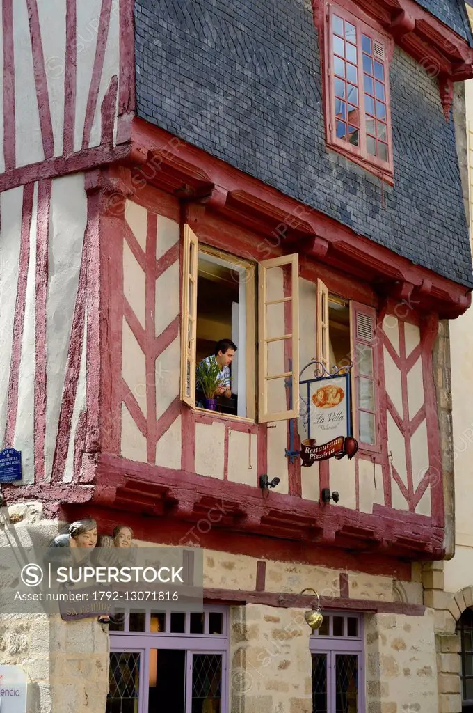 France, Morbihan, Gulf of Morbihan (Golfe du Morbihan), Vannes, sculpted wooden busts of Vannes and his wife on a half timbered house on Valencia squa...