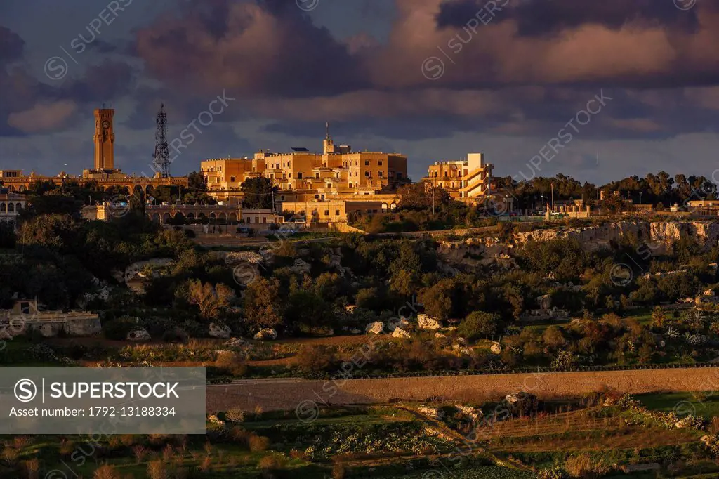 Malta, Mtarfa, former barracks converted into housing on a hill at sunset