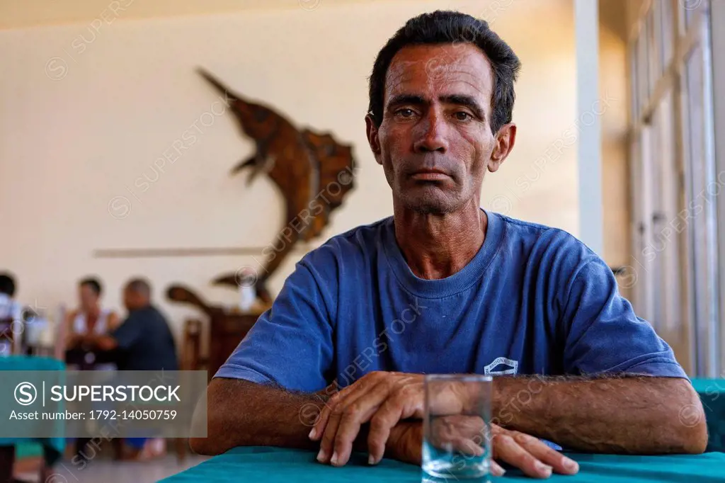 Cuba, Holguin, Gibara, Man with pensive face sitting in a cafe