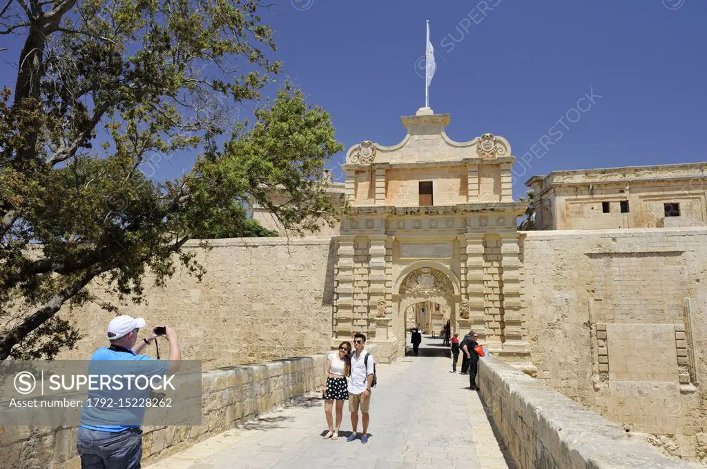 Malta, Mdina former capital, Mdina Gate main entrance of the city designed by the French architect Charles François de Mondion in 1724, couple being p...