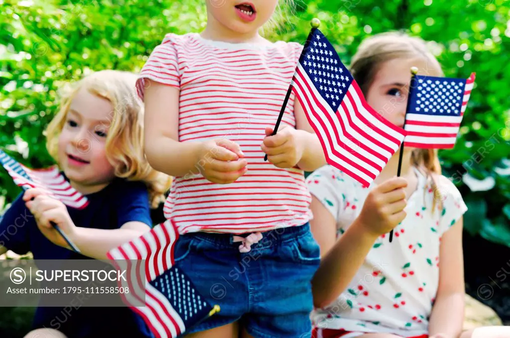 Children holding American flags