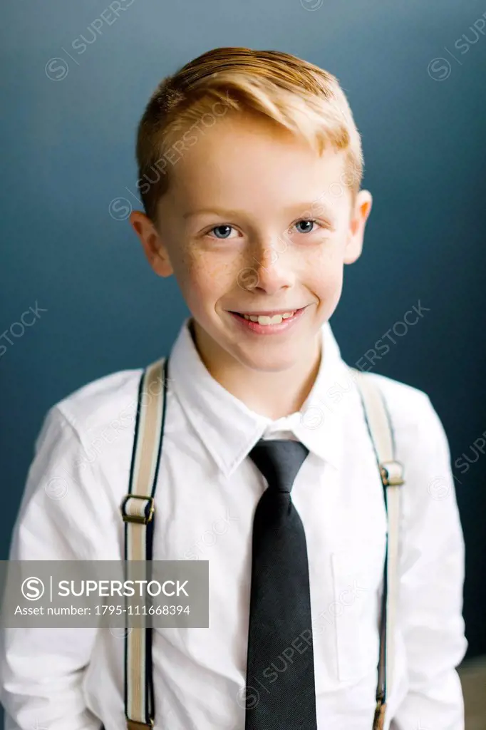 Portrait of smiling boy wearing tie