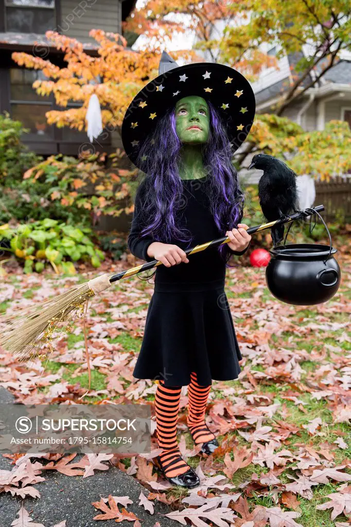 Girl in witch costume for Halloween