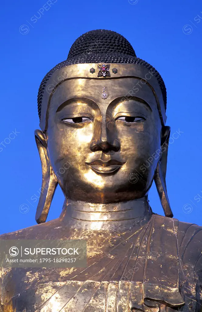 Myanmar, Mandalay, Giant Buddha statue in Buddhist temple