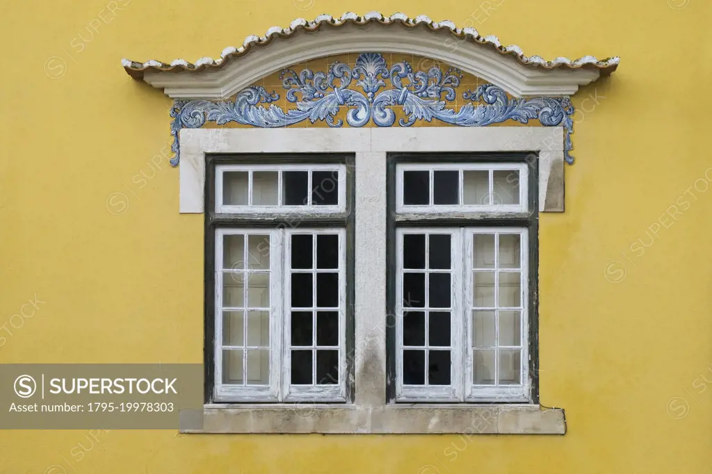 Portugal, Santarem, Yellow building with traditional tile work