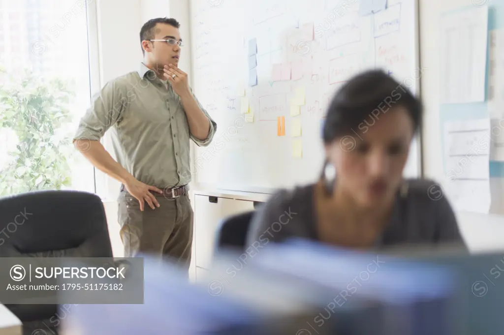 Two people working in office