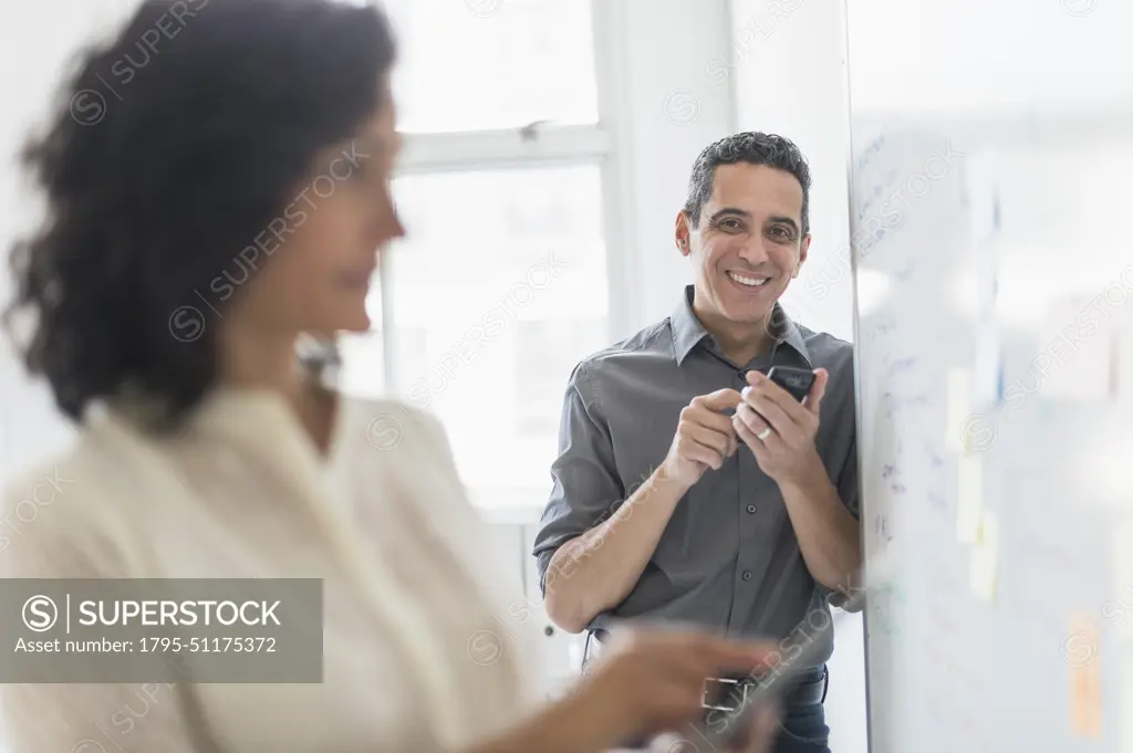 Man and woman working in office