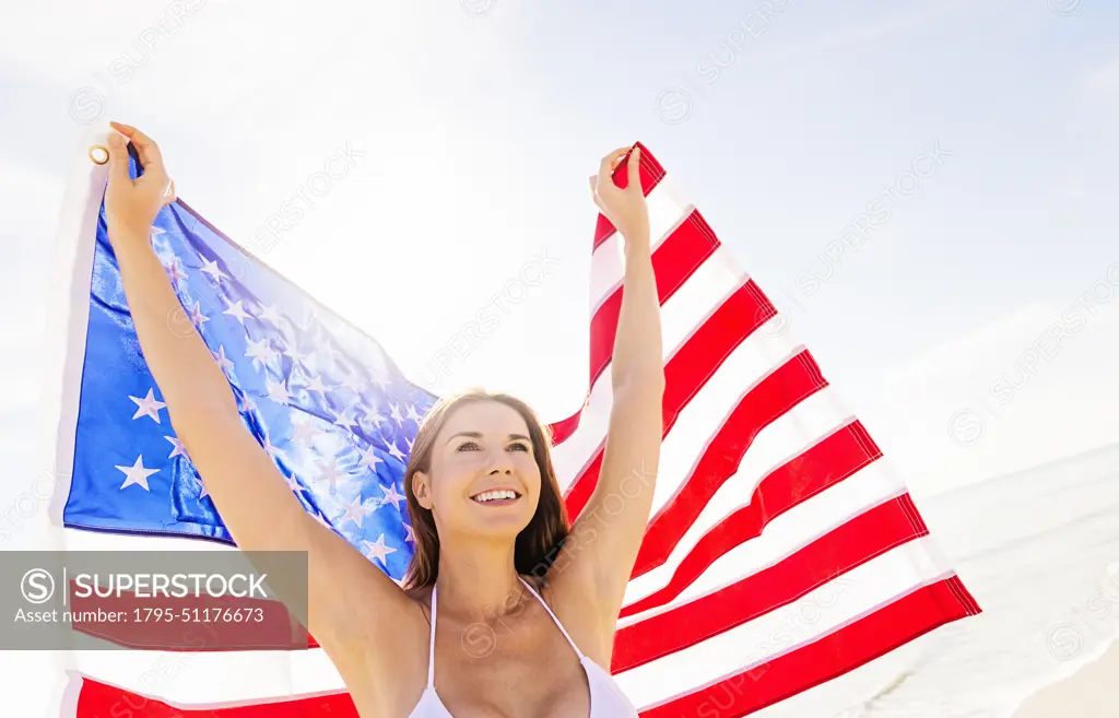 Woman holding American flag