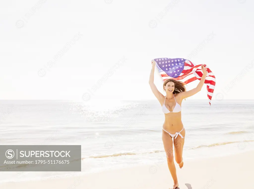 Woman holding American flag