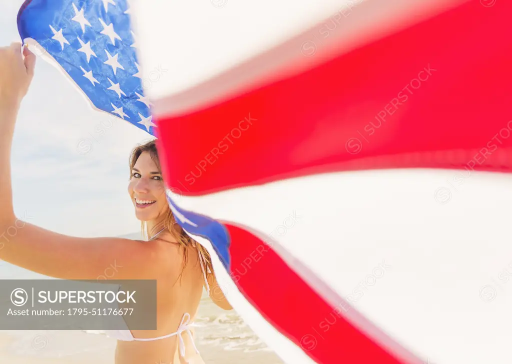 Woman holding American flag