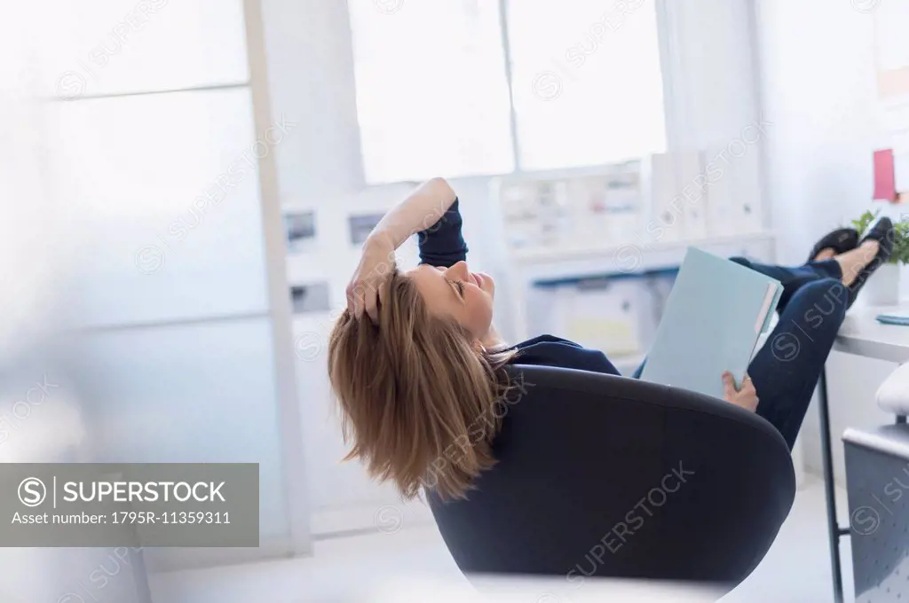 Business woman relaxing in office