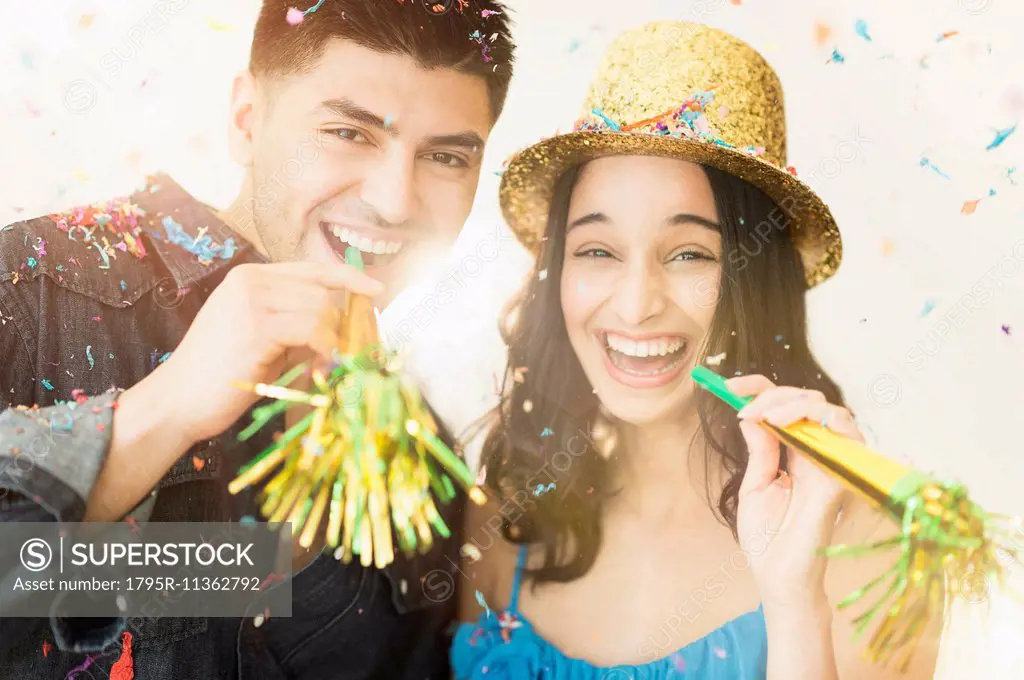 Young couple celebrating New Year's Eve