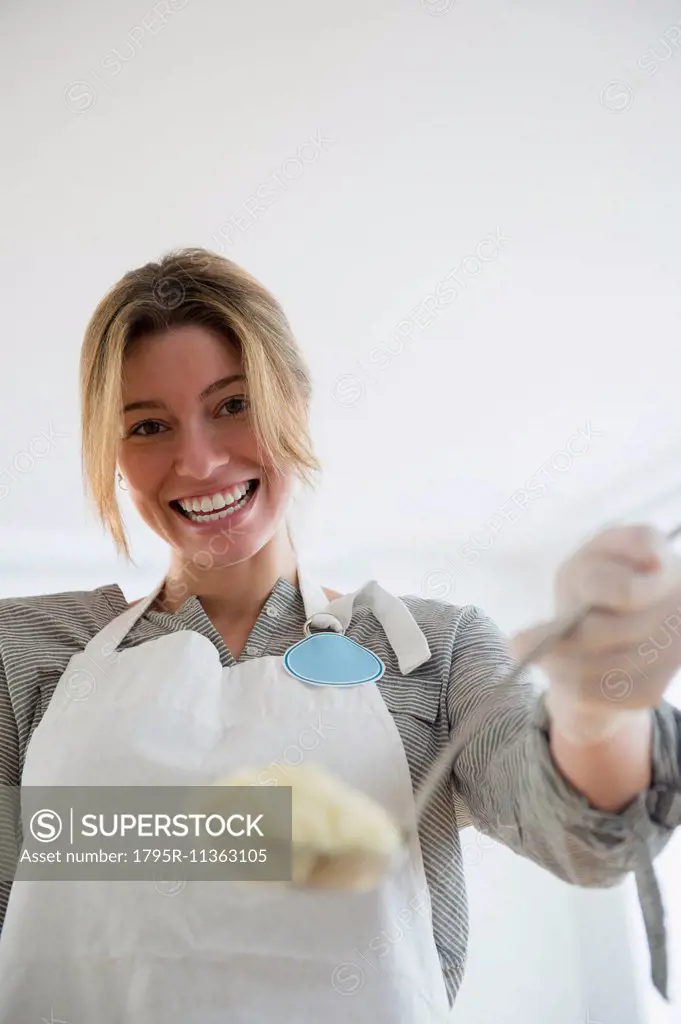 Portrait of charity volunteer holding food