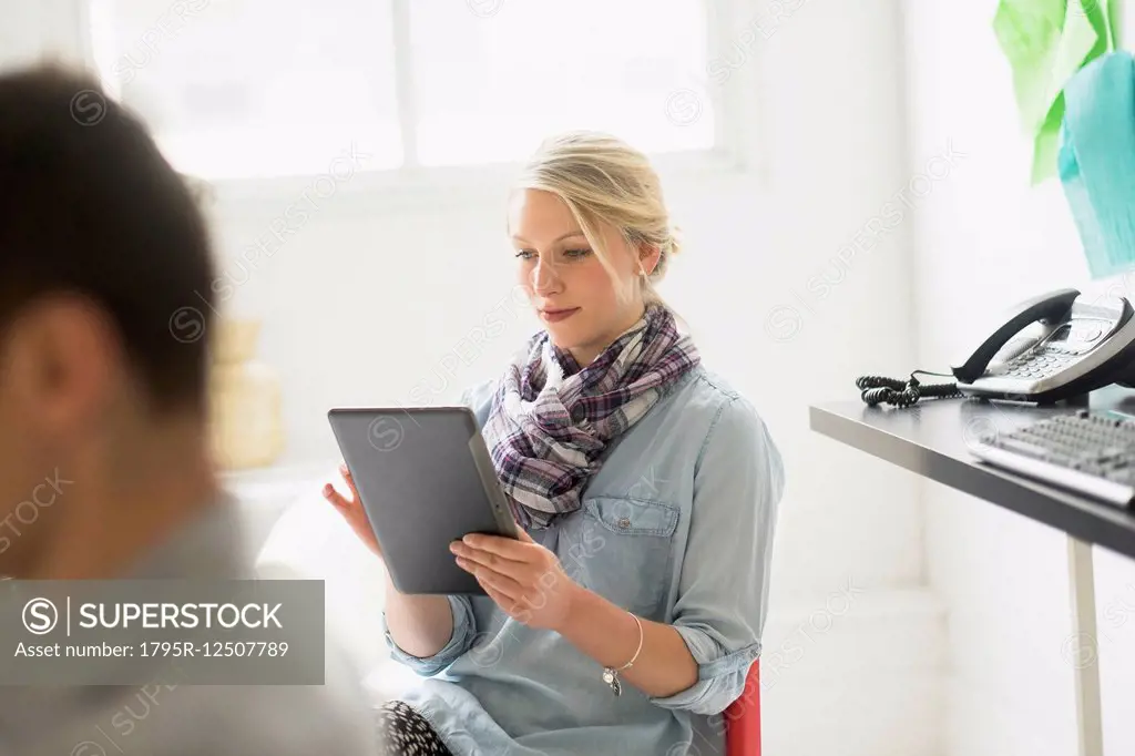 Man and woman working in office