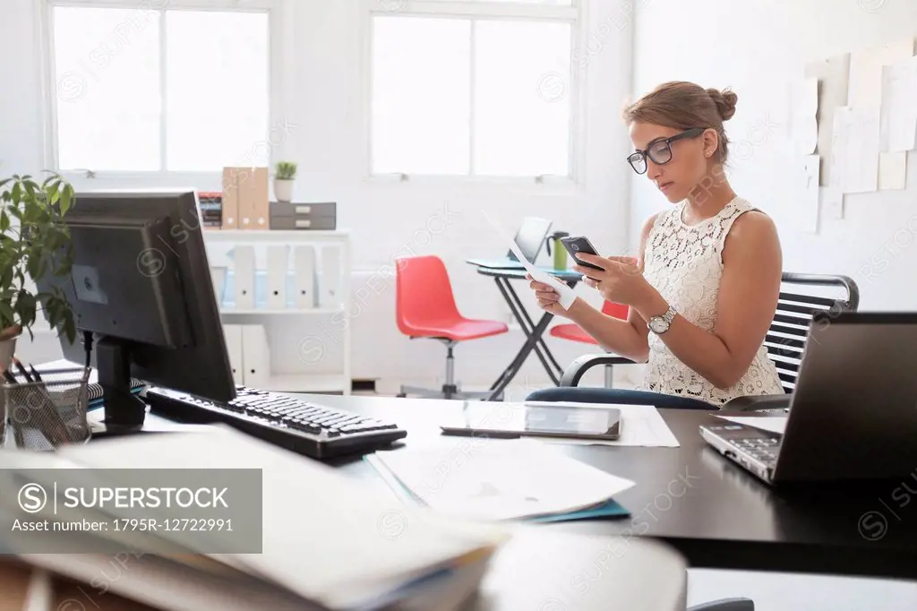 Young woman working in office