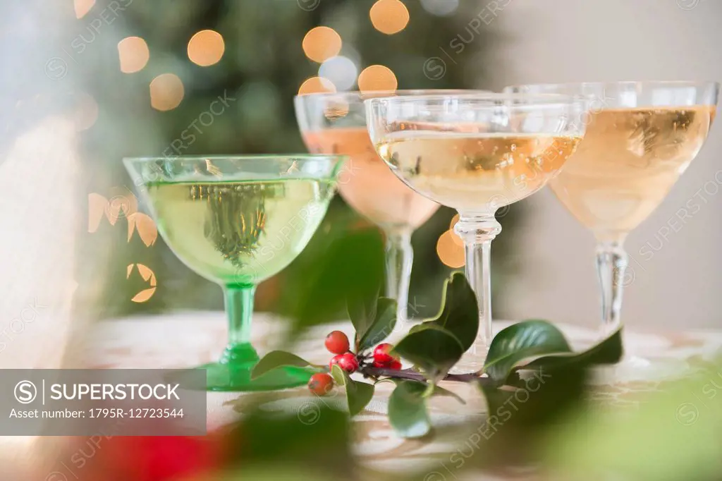 Wine glasses with drinks on festive table