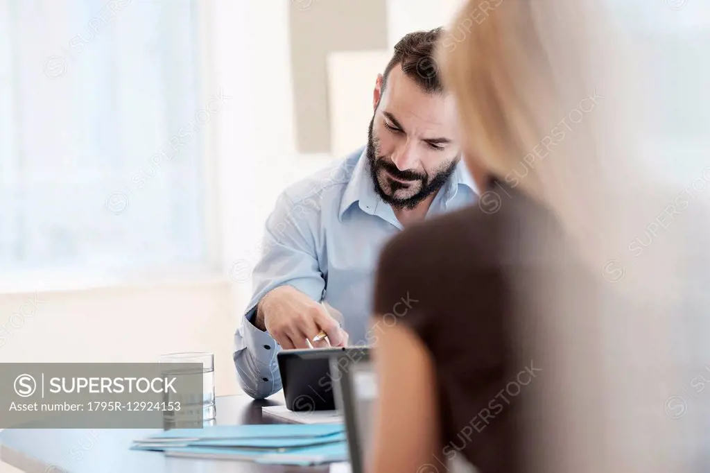 Man and woman working in office