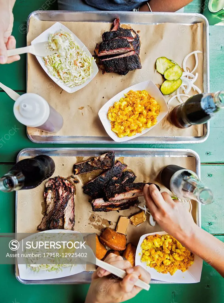 Friends eating barbecue food