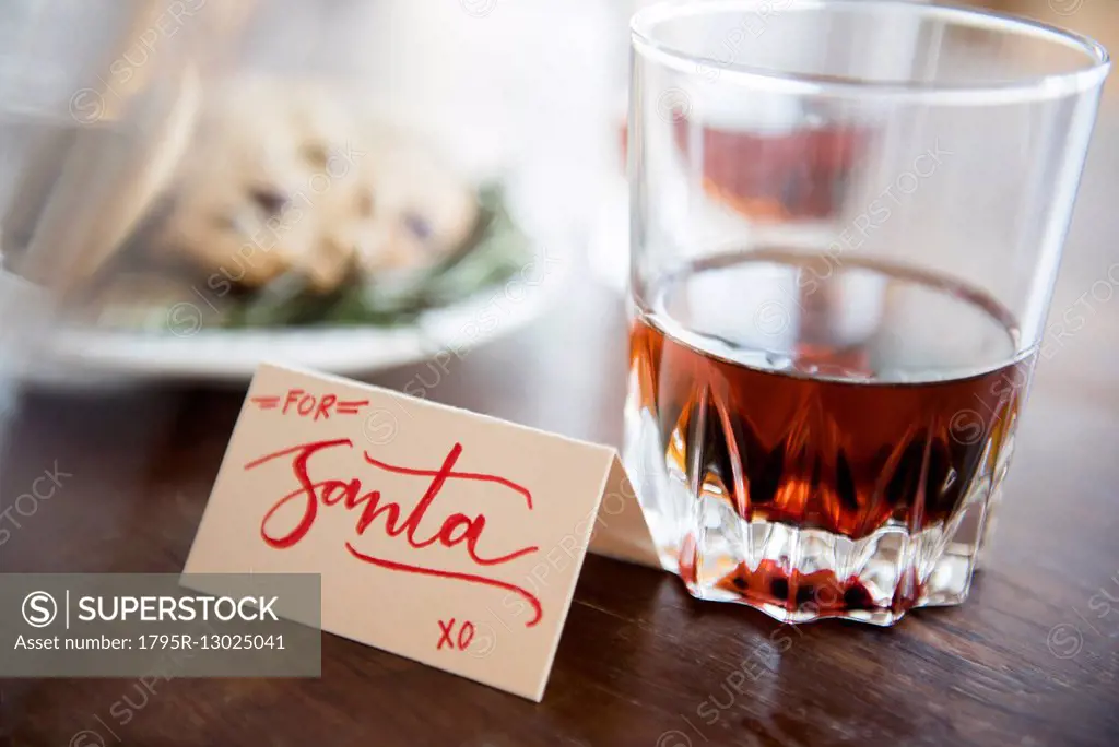 Manhattan drink and cookies on table during Christmas