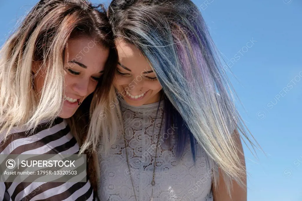 Smiling young women looking down