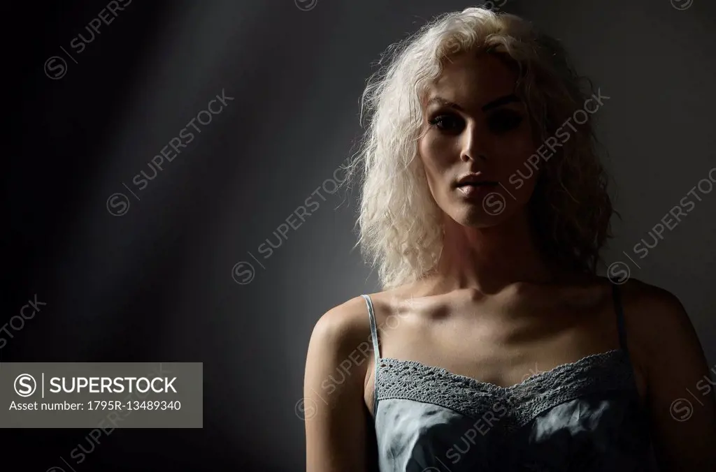 Studio portrait of young woman with white hair